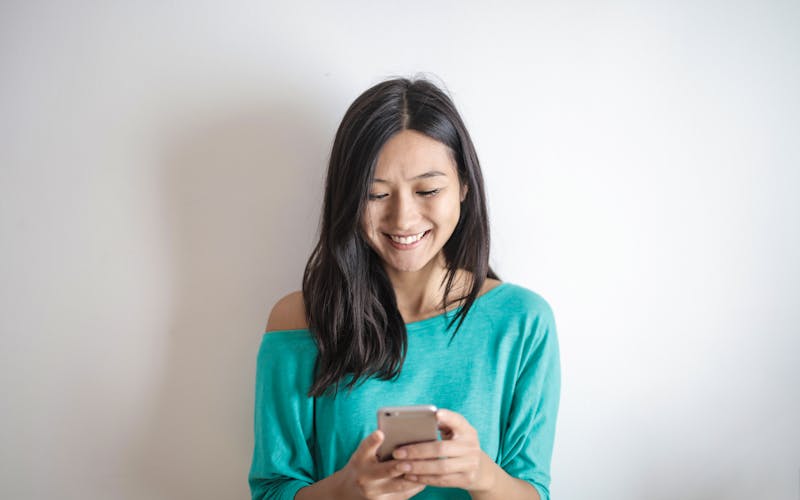 Happy customer getting in touch on their phone