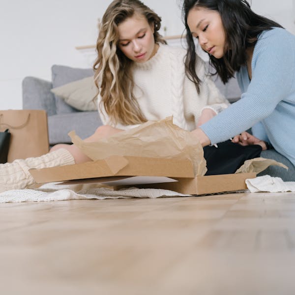 Happy customers unboxing their EatProtein delivery at home