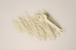 A scoop of collagen powder on a clean background — getting your daily dosage right