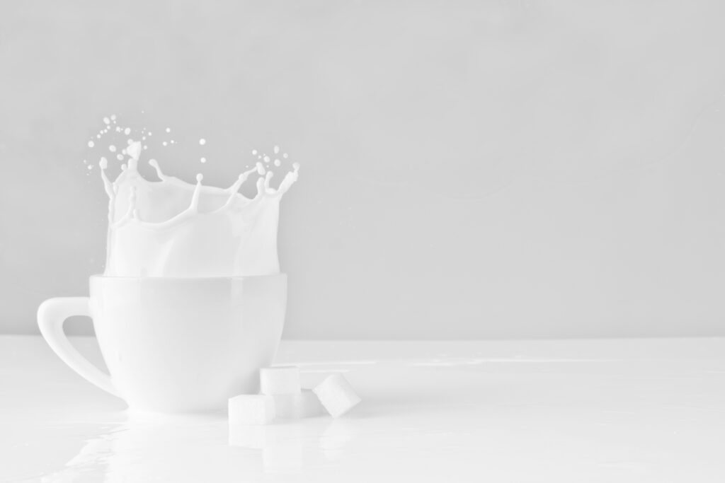 White powder supplement dissolving in a glass