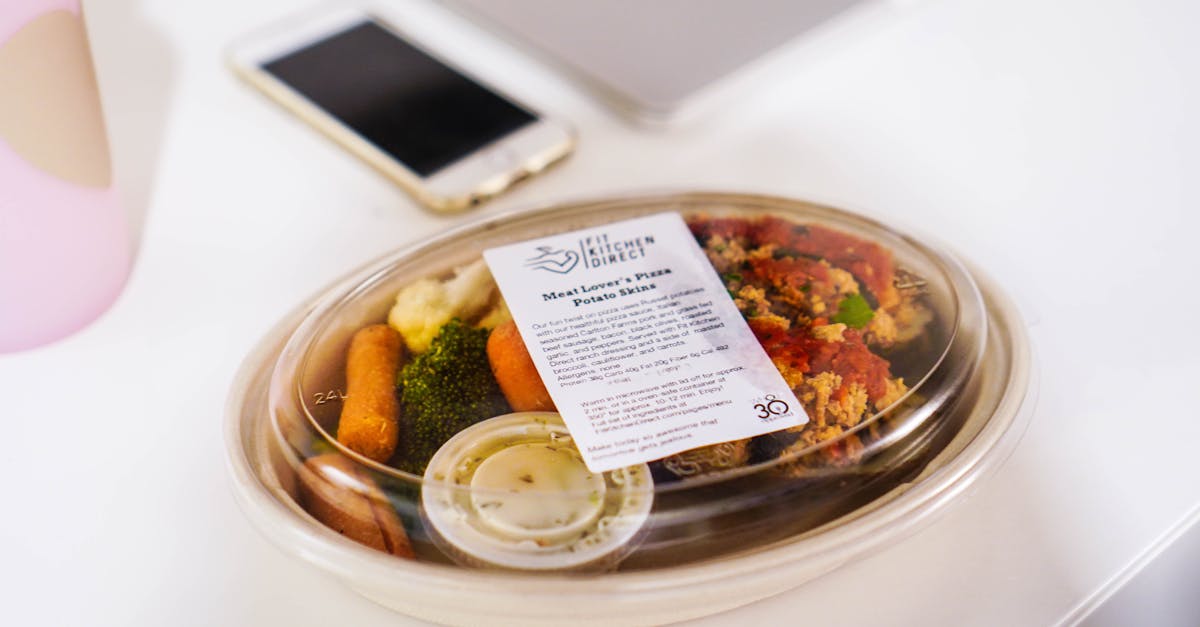 Meal prep snack box with fresh vegetables — preparing under-100-calorie protein snacks