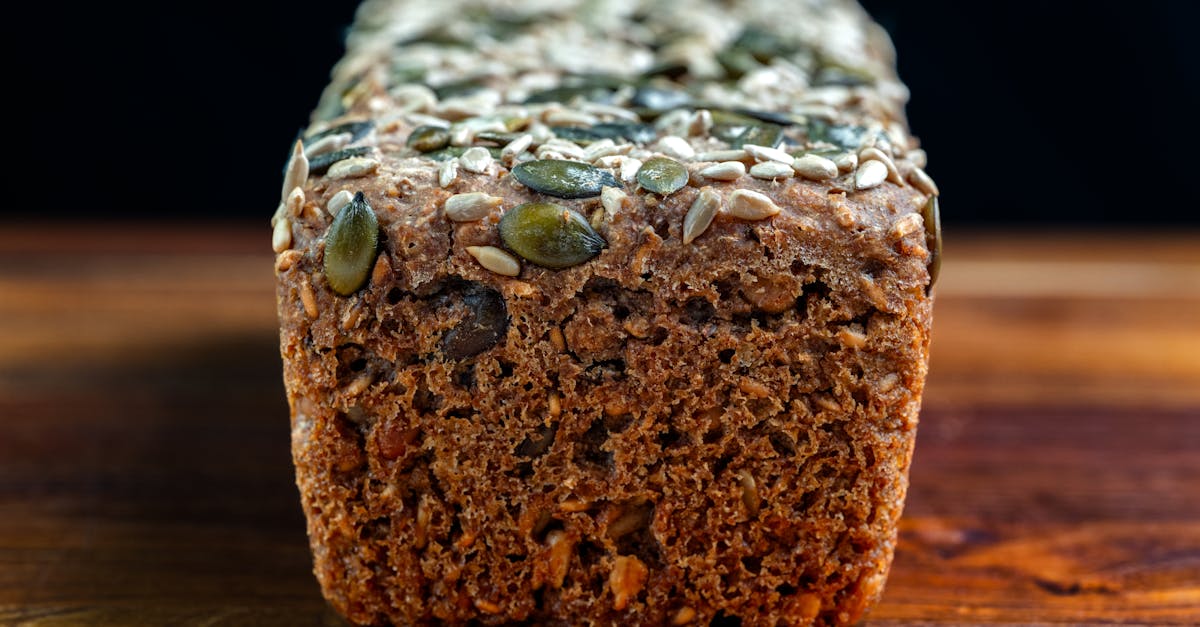 Artisan multigrain wholemeal bread loaf topped with pumpkin and sunflower seeds — insoluble fibre