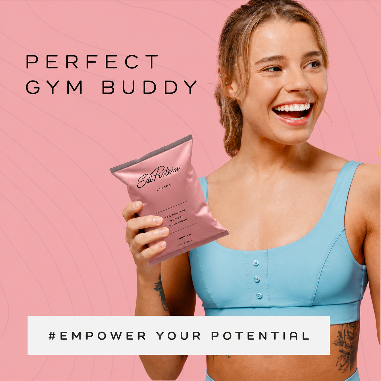 Woman in gym wear holding a pack of EatProtein Paprika Protein Crisps