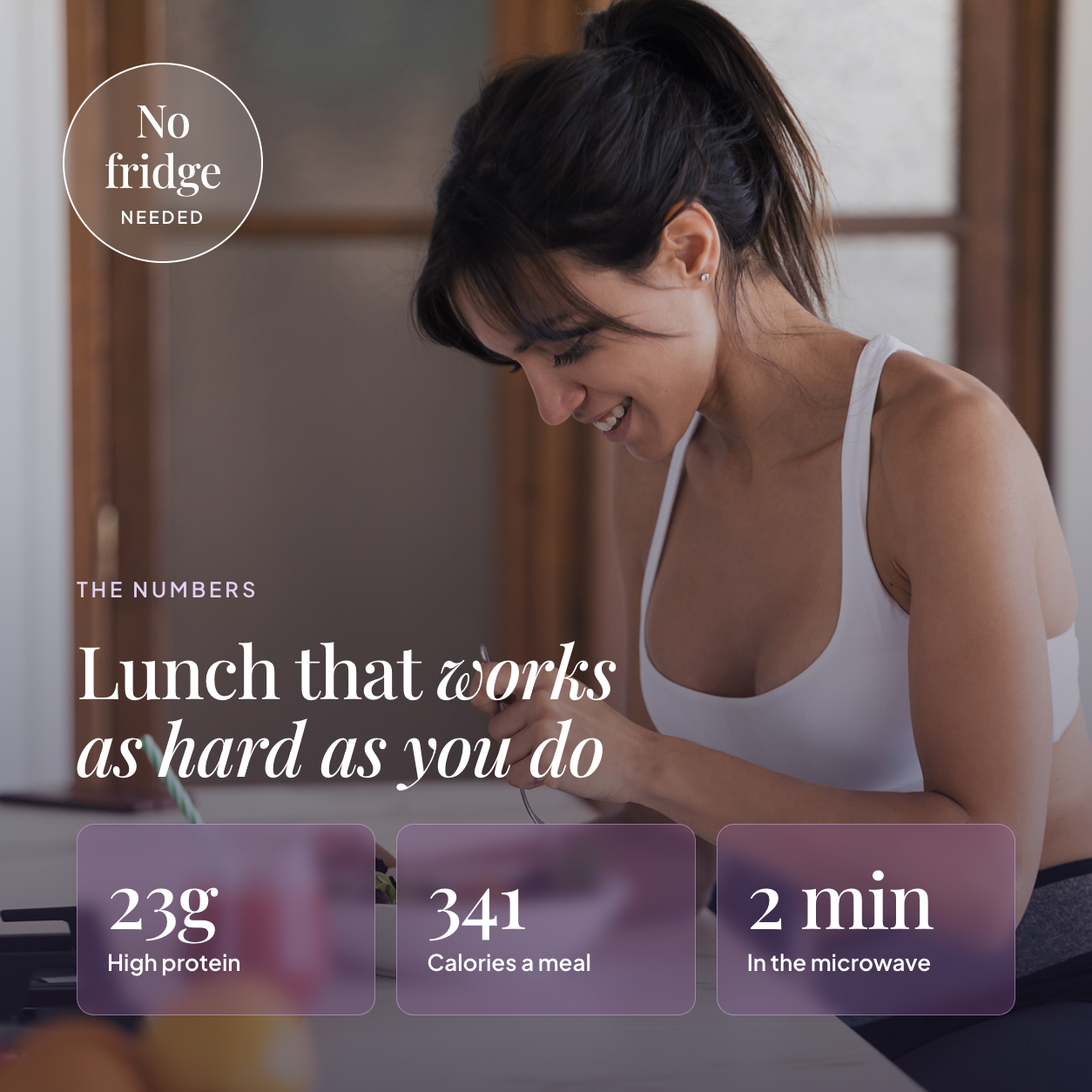 Woman eating an EatProtein penne arrabbiata ready meal at home — 23g protein, 341 calories a meal, 2 minutes in the microwave
