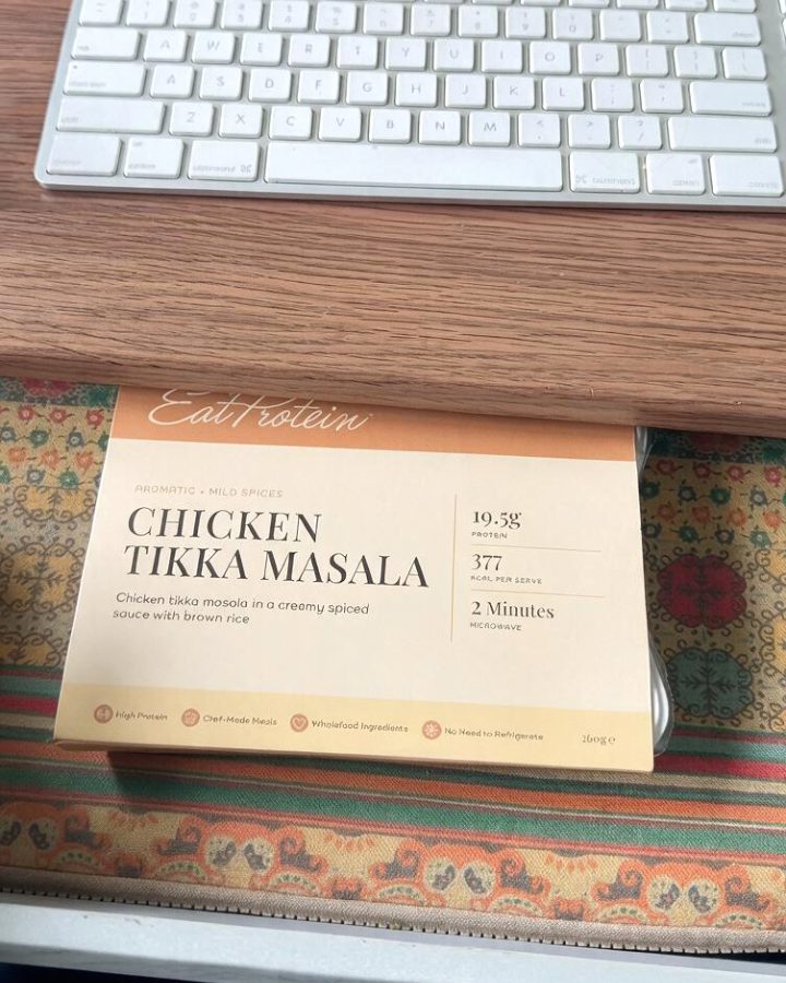 A ready meal in a desk drawer under a keyboard